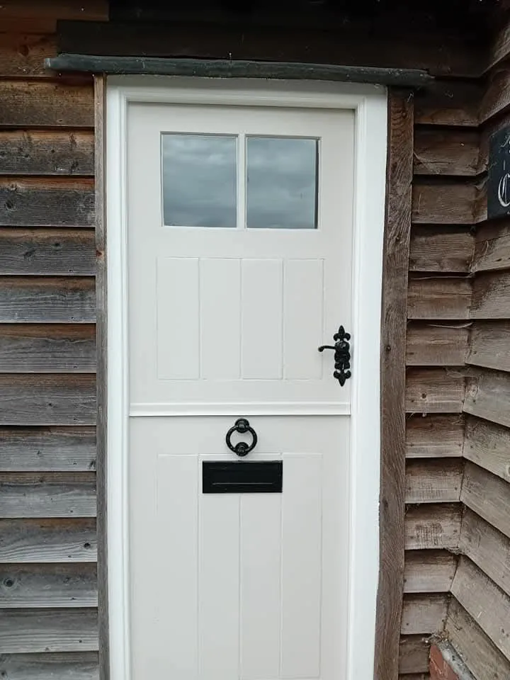 A white door with a black handle on it.