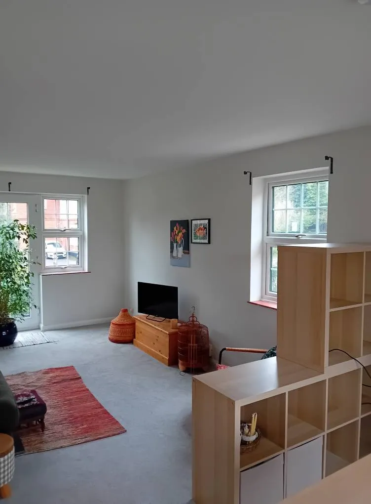 A living room filled with furniture and a flat screen tv.