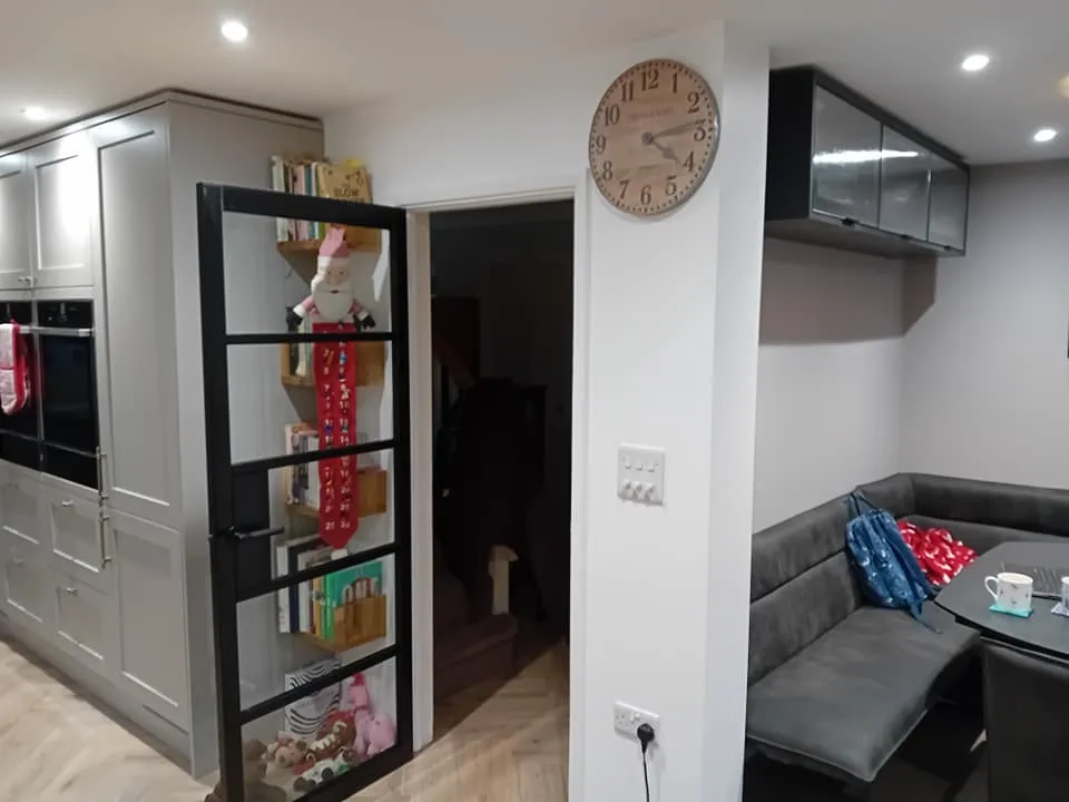 a kitchen and living room with a couch